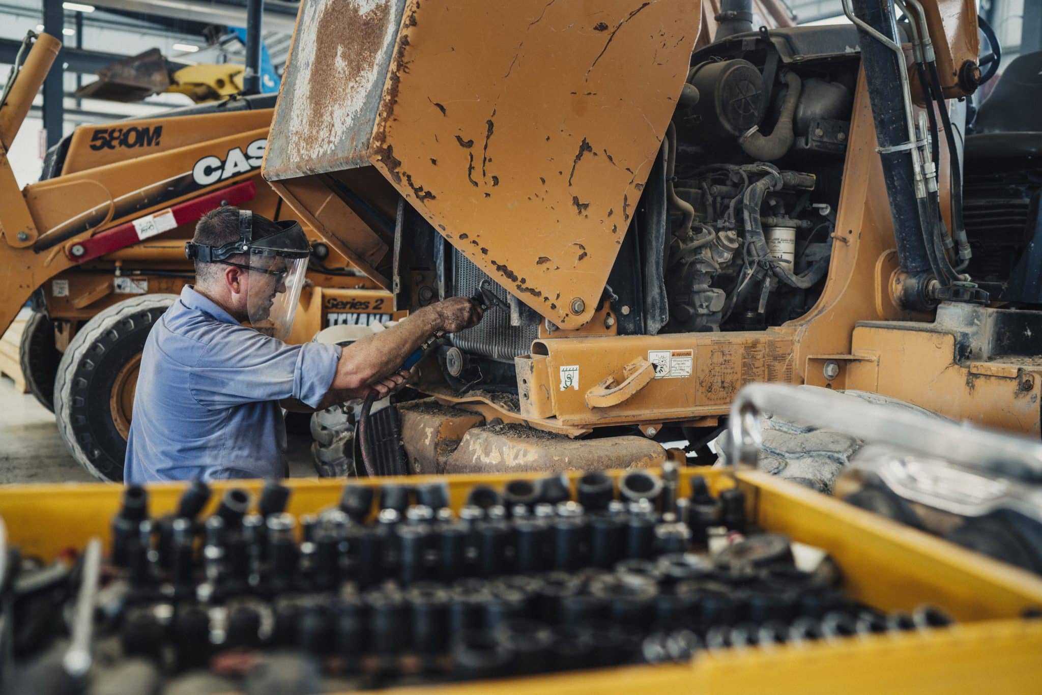 Heavy-duty technician inspecting equipment